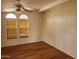 Bright living room featuring hardwood flooring, two large windows, and neutral paint at 5402 E Mckellips Rd # 103, Mesa, AZ 85215