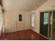 Bright sunroom featuring tile flooring and a glass sliding door at 5402 E Mckellips Rd # 103, Mesa, AZ 85215