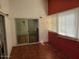 Enclosed sunroom with tile flooring, large windows, and ample natural light at 5402 E Mckellips Rd # 103, Mesa, AZ 85215
