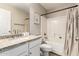 Bathroom with granite countertops, white cabinets, and shower with white tile at 5910 W Blue Sky Dr, Phoenix, AZ 85083