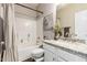 Updated bathroom with granite countertops, white cabinets, and tiled shower at 5910 W Blue Sky Dr, Phoenix, AZ 85083
