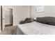 Bedroom featuring neutral carpet, gray recliner, and upholstered bed with tufted headboard at 5910 W Blue Sky Dr, Phoenix, AZ 85083