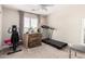 Bedroom with carpet and exercise equipment, including a treadmill and exercise bike at 5910 W Blue Sky Dr, Phoenix, AZ 85083