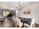 Bright dining room with an elegant table and chairs, connected to the living room and kitchen at 5910 W Blue Sky Dr, Phoenix, AZ 85083