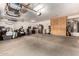 Spacious three car garage providing ample parking and storage solutions, as well as built-in cabinets at 5910 W Blue Sky Dr, Phoenix, AZ 85083