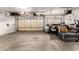 Spacious three car garage providing ample parking and storage solutions with overhead racks at 5910 W Blue Sky Dr, Phoenix, AZ 85083