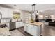 Beautiful kitchen with a granite island, modern appliances, and an open layout at 5910 W Blue Sky Dr, Phoenix, AZ 85083