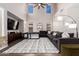Well-lit living room with a large sofa, high ceilings, and modern decor at 5910 W Blue Sky Dr, Phoenix, AZ 85083