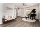 Living room featuring hardwood floors, a baby grand piano and natural light at 5910 W Blue Sky Dr, Phoenix, AZ 85083