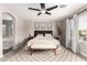 Cozy bedroom with neutral decor, carpet flooring, and a padded headboard at 5910 W Blue Sky Dr, Phoenix, AZ 85083