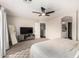 Bedroom with neutral colors and ensuite bathroom with a wall-mounted television at 5910 W Blue Sky Dr, Phoenix, AZ 85083