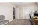 Office space with neutral carpet, chair, desk, and sliding closet doors at 5910 W Blue Sky Dr, Phoenix, AZ 85083