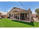 Inviting backyard with a covered patio, perfect for outdoor dining and relaxation at 654 W Fremont Dr, Tempe, AZ 85282