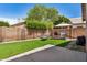 Private backyard with synthetic grass, a built-in barbecue, and charming decorative accents at 654 W Fremont Dr, Tempe, AZ 85282