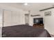 A serene bedroom features a spacious closet, television, and recessed lighting at 654 W Fremont Dr, Tempe, AZ 85282