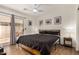 This bedroom features patio access, recessed lighting, and contemporary furnishings at 654 W Fremont Dr, Tempe, AZ 85282