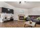 Cozy living room showcasing a stylish fireplace and entertainment center at 654 W Fremont Dr, Tempe, AZ 85282