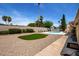 Expansive backyard featuring a well-maintained pool, lush artificial turf, and desert landscaping, ideal for outdoor enjoyment at 6622 E Voltaire Ave, Scottsdale, AZ 85254