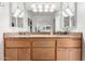 Bathroom vanity with double sinks, granite countertop, and modern fixtures at 6622 E Voltaire Ave, Scottsdale, AZ 85254