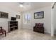 Bedroom with a window, tile floors, and a wooden chest at 6622 E Voltaire Ave, Scottsdale, AZ 85254