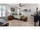Bright bedroom features tile flooring and a cozy twin bed with a green floral quilt at 6622 E Voltaire Ave, Scottsdale, AZ 85254