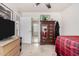 Bedroom featuring natural light, a wardrobe with a mirror, and tile floors at 6622 E Voltaire Ave, Scottsdale, AZ 85254
