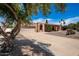 Charming single-story home with a well-manicured yard and a spacious two-car garage, exuding curb appeal and comfort at 6622 E Voltaire Ave, Scottsdale, AZ 85254