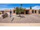 Charming single-story home with desert landscaping and a spacious driveway, offering curb appeal and a welcoming entrance at 6622 E Voltaire Ave, Scottsdale, AZ 85254