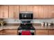 Modern kitchen featuring stainless steel appliances and sleek, light wood cabinetry at 6622 E Voltaire Ave, Scottsdale, AZ 85254