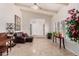 Elegant living room with beamed ceiling, travertine floors, and a cozy seating area at 6622 E Voltaire Ave, Scottsdale, AZ 85254