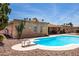 Backyard oasis featuring a refreshing pool with diving board alongside desert landscaping and brickwork for timeless charm at 6622 E Voltaire Ave, Scottsdale, AZ 85254