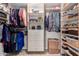 Organized walk-in closet with built-in shelves, drawers, and ample hanging space at 6622 E Voltaire Ave, Scottsdale, AZ 85254