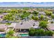 A stunning aerial view of a single-Gathering home featuring a private pool and lush backyard landscaping at 7018 E Ingram St, Mesa, AZ 85207