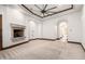 Spacious bedroom featuring neutral carpet, stone fireplace, and natural light at 7018 E Ingram St, Mesa, AZ 85207