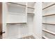 Bright walk-in closet with ample shelving and storage space at 7018 E Ingram St, Mesa, AZ 85207