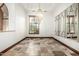 Charming dining room with tile floors, natural light, wooden shutters, and decorative mirrors at 7018 E Ingram St, Mesa, AZ 85207