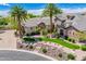 Aerial view of a luxurious home with manicured landscaping, stone accents, and a grand entrance at 7018 E Ingram St, Mesa, AZ 85207