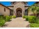 Elegant property featuring a beautiful stone entry and a solid wood door at 7018 E Ingram St, Mesa, AZ 85207