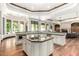 Spacious gourmet kitchen featuring a large island, modern appliances, and an abundance of counter and cabinet space at 7018 E Ingram St, Mesa, AZ 85207
