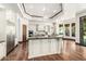 Gourmet kitchen with stainless steel appliances, a large center island, and custom cabinetry at 7018 E Ingram St, Mesa, AZ 85207