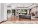 Spacious living room featuring a stone fireplace, hardwood floors, and large windows with natural light at 7018 E Ingram St, Mesa, AZ 85207