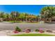 Community playground featuring mature shade trees, colorful structures, and shade canopies at 7018 E Ingram St, Mesa, AZ 85207
