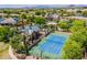 This community has a tennis court with ramada surrounded by mature trees and lush landscaping at 7018 E Ingram St, Mesa, AZ 85207