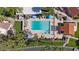 Overhead shot of the community pool area with clear blue water, lounge areas, and lush surroundings at 7405 N Via Camello Del Norte -- # 137, Scottsdale, AZ 85258