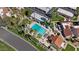 Aerial view of the pool area with palm trees, lounge chairs, and nearby residential buildings at 7405 N Via Camello Del Norte -- # 137, Scottsdale, AZ 85258