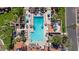 Aerial view of the community pool area, showcasing the pool, spa, lounge chairs, and lush landscaping at 7405 N Via Camello Del Norte -- # 137, Scottsdale, AZ 85258