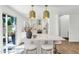 Bright kitchen featuring a center island with seating, modern lighting, and a seamless transition to the outdoors at 7405 N Via Camello Del Norte -- # 137, Scottsdale, AZ 85258