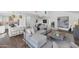 Spacious living area with large sectional, white walls, seamless to kitchen and dining, perfect for entertaining at 7405 N Via Camello Del Norte -- # 137, Scottsdale, AZ 85258