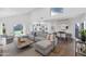 Open-concept living space featuring a plush sectional sofa and seamless flow to the kitchen and dining area at 7405 N Via Camello Del Norte -- # 137, Scottsdale, AZ 85258