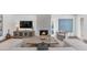Bright living room featuring a stone fireplace, modern furnishings, and an abundance of natural light at 7405 N Via Camello Del Norte -- # 137, Scottsdale, AZ 85258